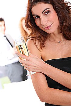 Beautiful smiling woman holding glass of champagne