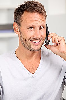Man in the office talking on the phone