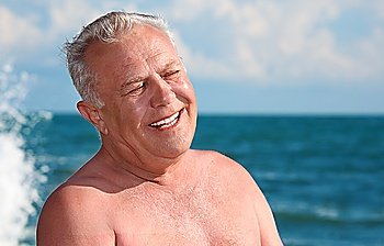 elderly smiling man on seacoast