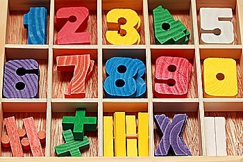 math game for junior age with colored wooden signs of numbers horizontal