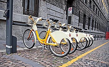 Row of bicycles for rent in Milano, Italy