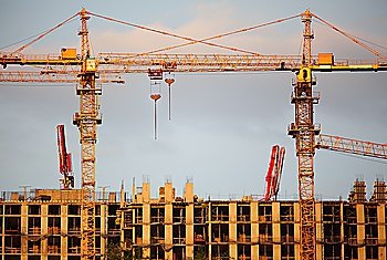 Two cranes on building building