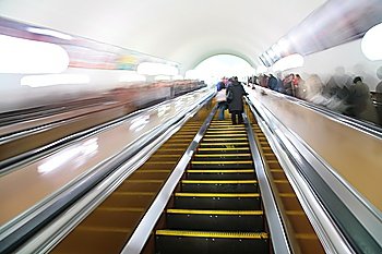 abstract passengers on escalator. motion blur