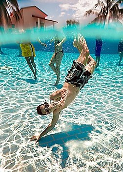 teenager floatsunder water in pool