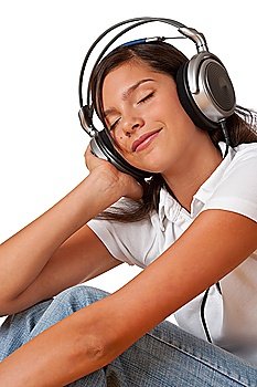 Teenager with closed eyes listening to music with headphones