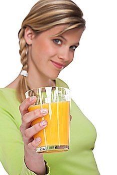 Healthy lifestyle series - Glass of orange juice on white background, focus on hand