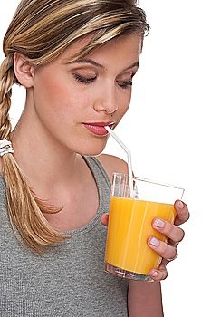 Healthy lifestyle series - Blond woman drinking orange juice on white background