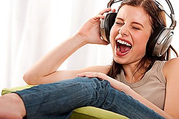Young teenage girl listening to music