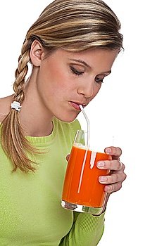 Woman drinking carrot juice on white background