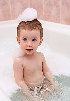 fun baby bath in bathtub with foam