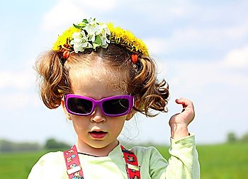 cute funny little girl in sunglasses portrait