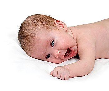 yawn newborn baby lying on white sheet
