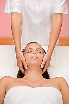 Body care - woman facial massage at day spa