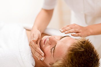 Male cosmetics - facial massage at luxury spa