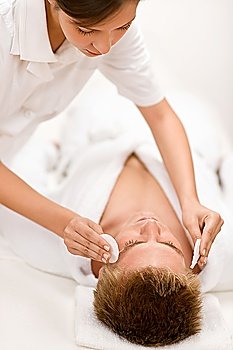 Male cosmetics - cleaning face treatment at luxury spa