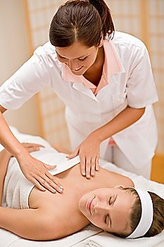 Skincare - woman cleavage massage at salon in day spa