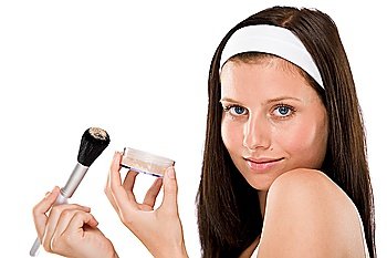 Beautiful woman applying powder with brush on white background