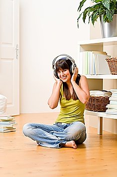 Teenager girl relax home - happy listen to music with headphones
