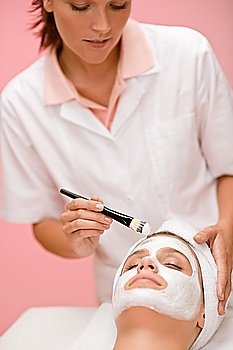 Facial mask - Woman at beauty treatment at luxury spa