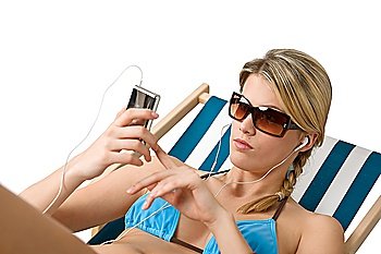 Beach - Happy woman in bikini relax on deck chair with music