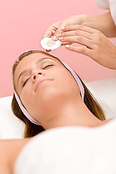 Facial care - woman cosmetics treatment in salon