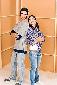 Home improvement young couple posing together in new house