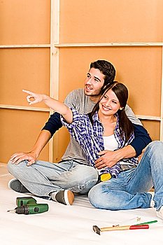 Home improvement young happy couple repair tool relax on floor