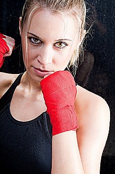 Boxing training blond woman sparring and sweating