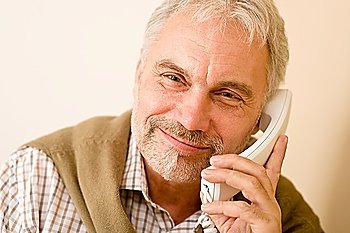 Happy senior mature man on the phone, smiling