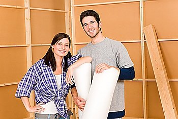 Home improvement young couple working on floor renovations