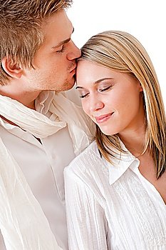 Couple in love - romantic kiss, wear white clothes