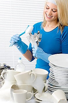 Modern kitchen - happy woman washing dishes, housework