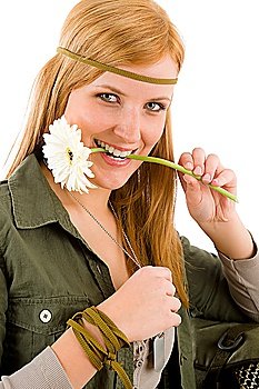 Hippie young happy woman hold gerbera daisy with teeth
