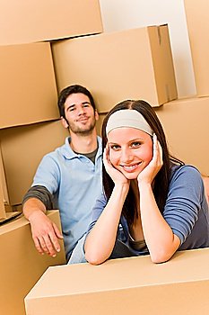 Moving into new home young happy couple sitting on floor