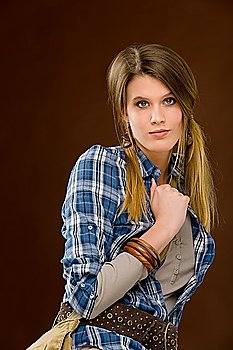 Fashion model - young woman posing in country style clothes
