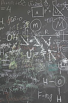 grey school chalkboard with many different formuls, signs and counts vertical