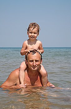 Man with child in sea