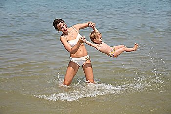 Mum and daughter have a good time in the sea