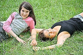mother and daughter-teenager lie on the grass 2