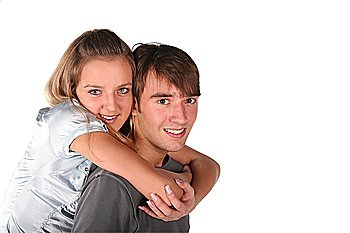 girl embraces boy from back on white