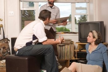 Men and Woman Sitting Around with Record Collection