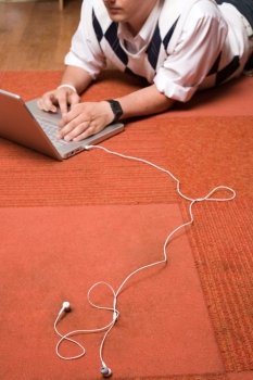 Red Rug, Laptop, White Headphones