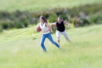 Man and Woman Playing Ball in Field