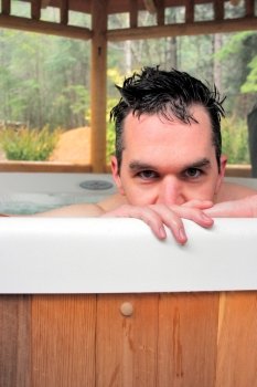 Man in Outdoor Hot Tub