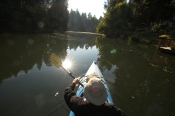 Man Canoeing on Glassy Lake