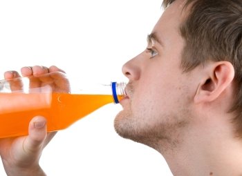 Man drinking orange juice isolated on white