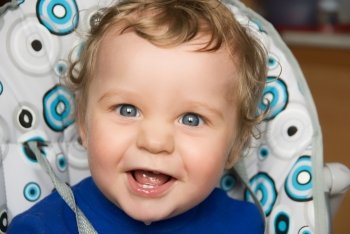 pretty baby boy laughing portrait closeup