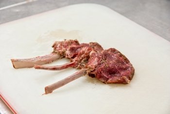 raw marinated lamb meat on the table