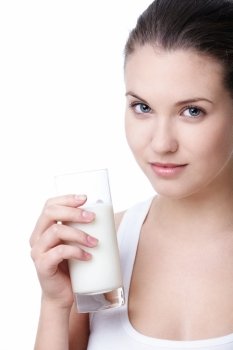 Attractive young girl with a glass of milk on a white background
