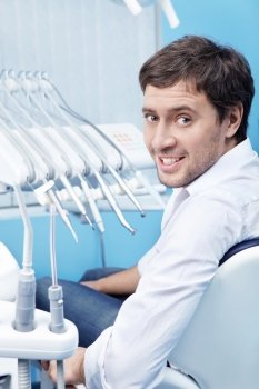 Attractive young man in dentistry